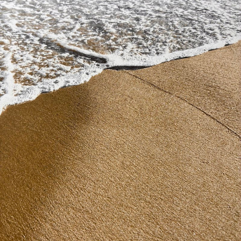 Sandstrand mit Meer als Druck